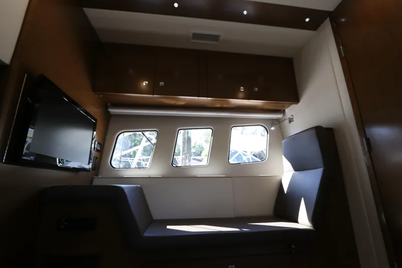 Slide: The Image of Interior of 2015 Cruisers Yachts 45 Cantius with sofa and windows. - 9