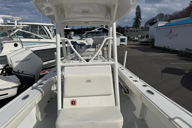 Slide: The Image of 2022 Steiger Craft 255 Tournament boat with Mercury engine, docked in a marina. - 2