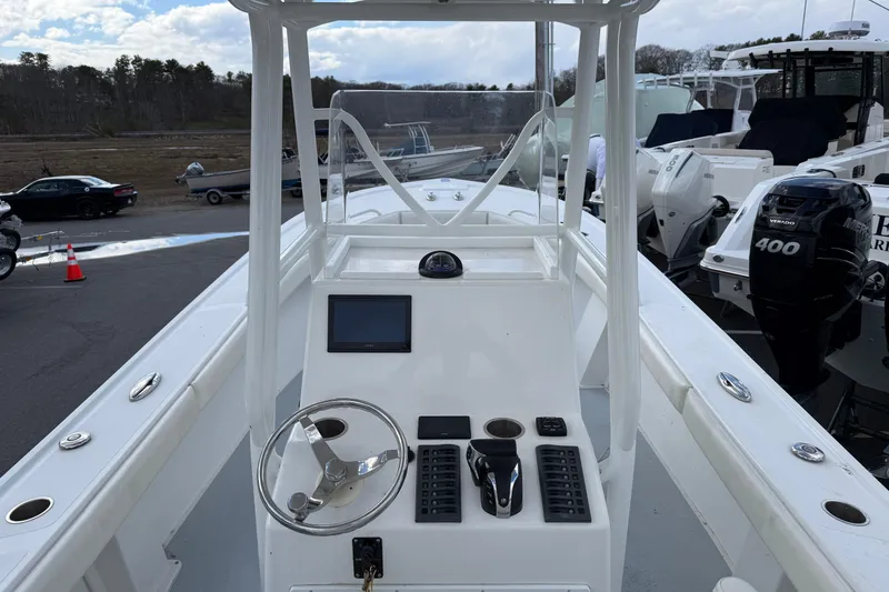 Slide: The Image of 2022 Steiger Craft 255 Tournament boat dashboard with steering wheel and controls. - 3