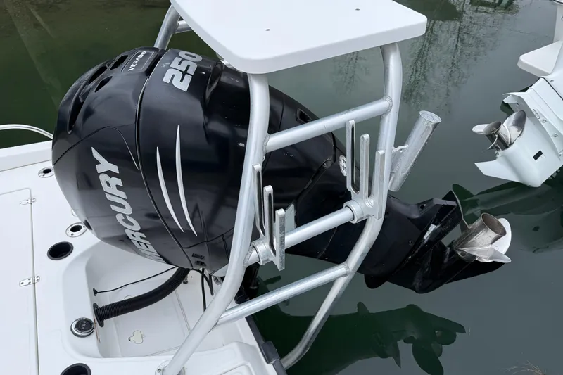 Slide: The Image of Boston Whaler 230 Dauntless 2008 with Mercury 250 outboard motor on water. - 2