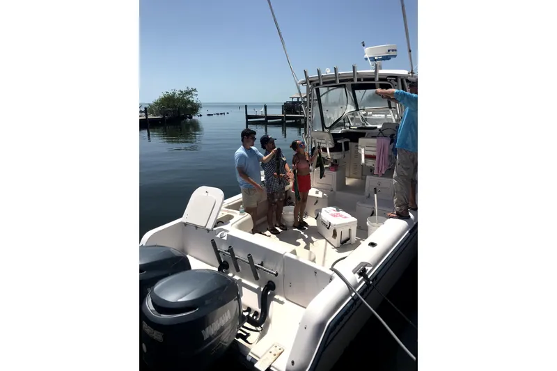 Slide: The Image of 2003 Grady-White Sailfish 282 boat with people enjoying a sunny day on the water. - 5