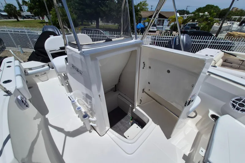 Slide: The Image of 2026 Robalo R180 Center Console boat interior with open storage compartment. - 14