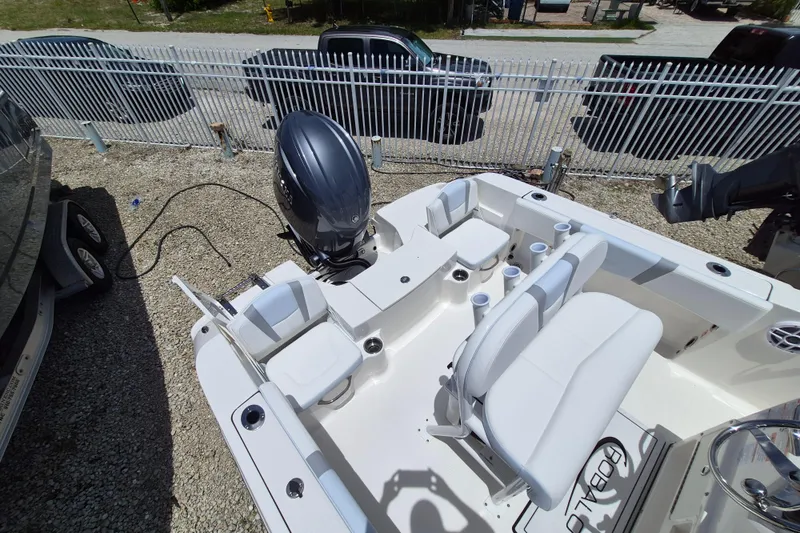 Slide: The Image of 2026 Robalo R180 Center Console boat with seating and outboard motor. - 16