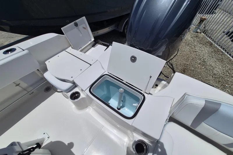 Slide: The Image of 2026 Robalo R180 Center Console boat interior with open storage compartments. - 17