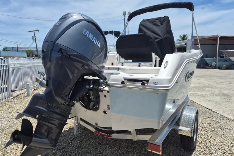 Slide: The Image of 2026 Robalo R180 Center Console boat with Yamaha outboard motor on trailer. - 18