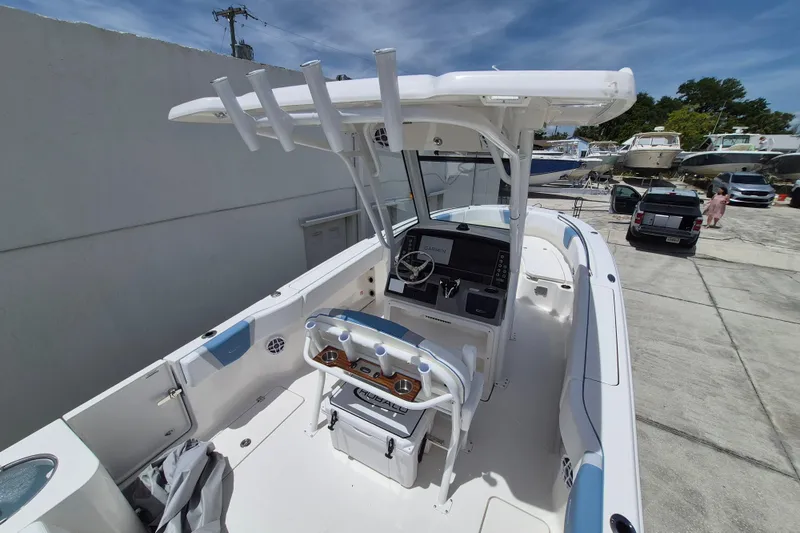 Slide: The Image of 2026 Robalo R250 Center Console boat with modern helm and seating. - 12