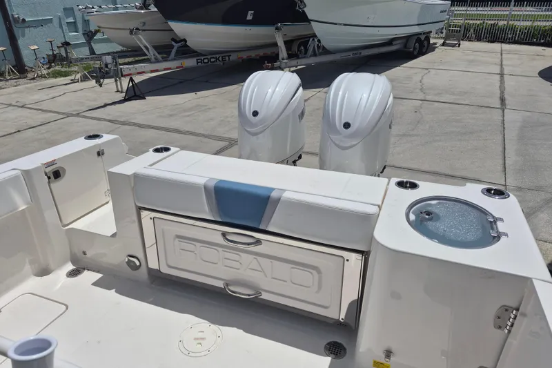 Slide: The Image of 2026 Robalo R250 Center Console boat with dual engines and seating area. - 16