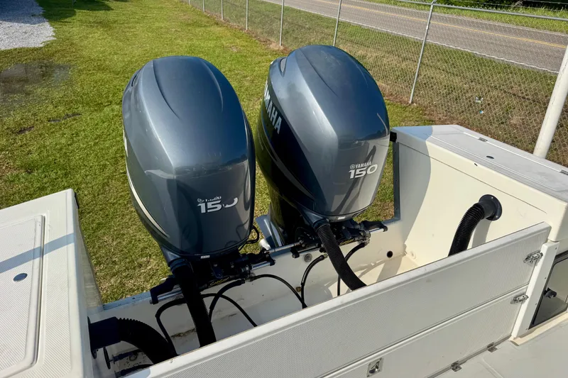Slide: The Image of Twin Yamaha 150 outboard engines on a 1994 Regulator 23 Center Console boat. - 6
