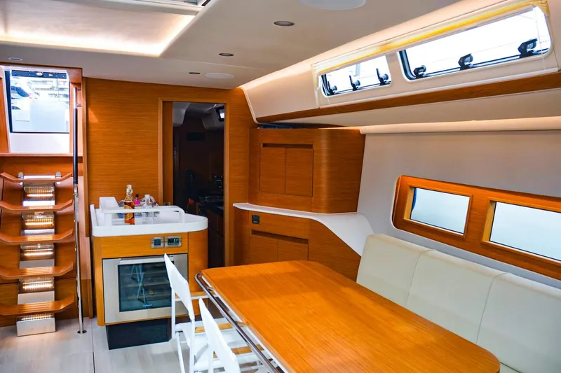 Slide: The Image of Luxurious interior of 2018 Hanse 675 yacht with modern kitchen and dining area. - 10