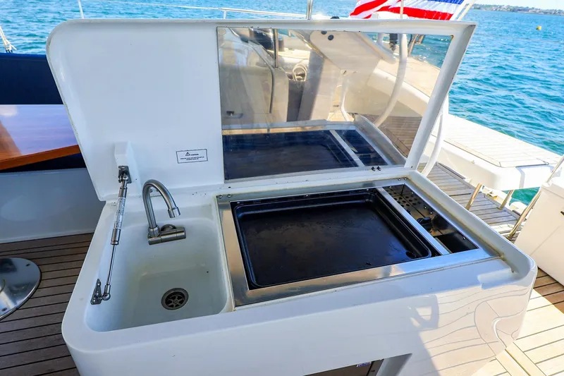 Slide: The Image of Outdoor sink and grill on 2018 Hanse 675 yacht, overlooking the ocean. - 18