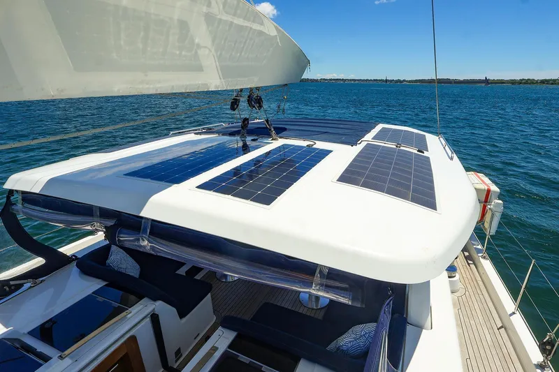Slide: The Image of Sailing yacht Hanse 675 (2018) with solar panels on deck, cruising on open water. - 22