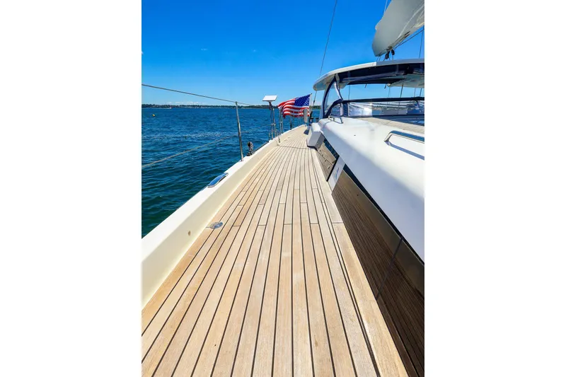 Slide: The Image of Luxurious 2018 Hanse 675 yacht deck with ocean view and clear blue sky. - 24