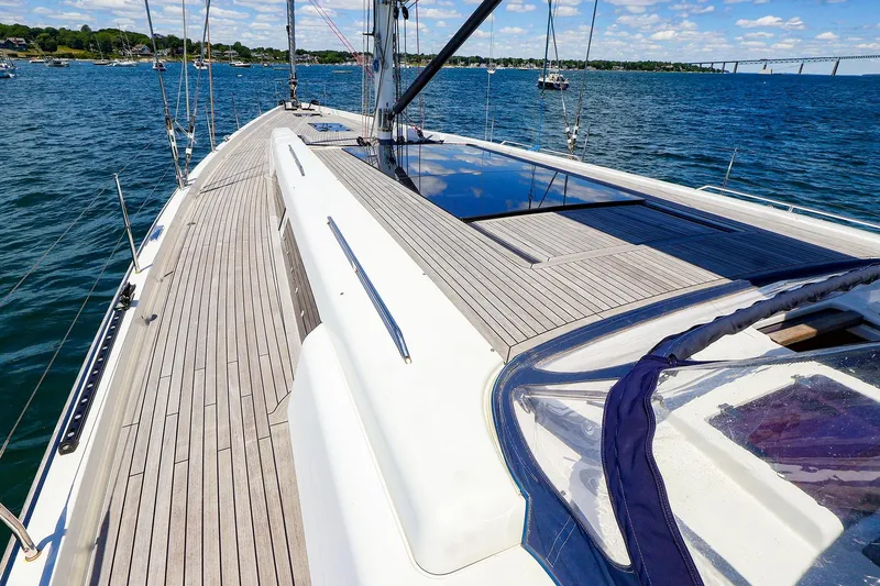 Slide: The Image of 2018 Hanse 675 yacht deck with sleek design on open water. - 25