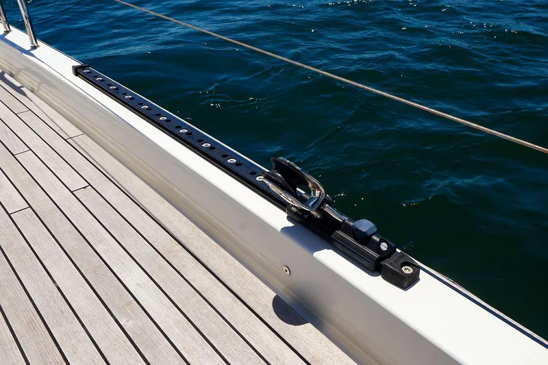 Slide: The Image of Deck of 2018 Hanse 675 yacht with sleek railing and ocean view. - 26