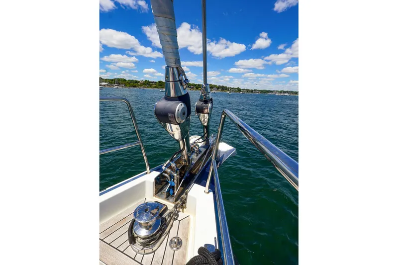 Slide: The Image of Bow of 2018 Hanse 675 yacht with clear blue sky and water. - 32