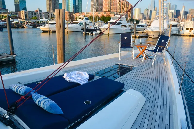 Slide: The Image of Luxurious 2018 Hanse 675 yacht docked in a scenic marina with city skyline. - 34