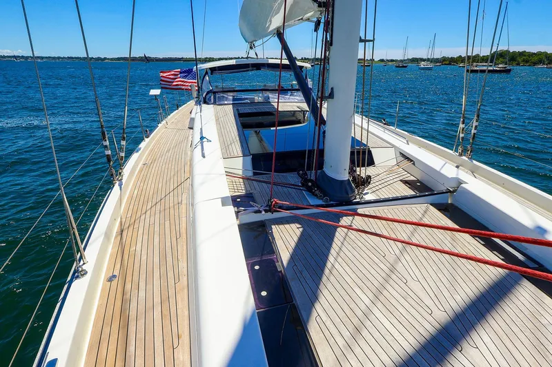 Slide: The Image of 2018 Hanse 675 yacht sailing on a sunny day, showcasing sleek deck design and vibrant waters. - 40
