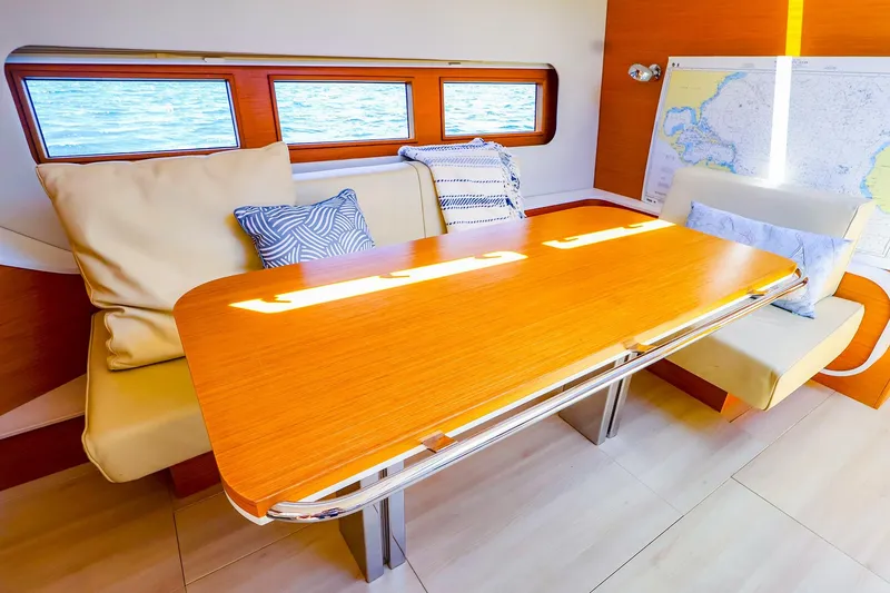 Slide: The Image of Luxurious interior of 2018 Hanse 675 yacht with elegant dining area and nautical decor. - 46