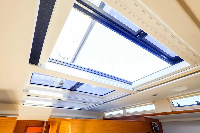 Slide: The Image of Interior view of 2018 Hanse 675 yacht skylight, showcasing modern design and natural lighting. - 49