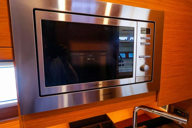 Slide: The Image of Built-in microwave in 2018 Hanse 675 yacht kitchen interior. - 59