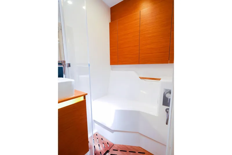 Slide: The Image of Luxurious bathroom interior of 2018 Hanse 675 yacht with modern wood accents. - 69