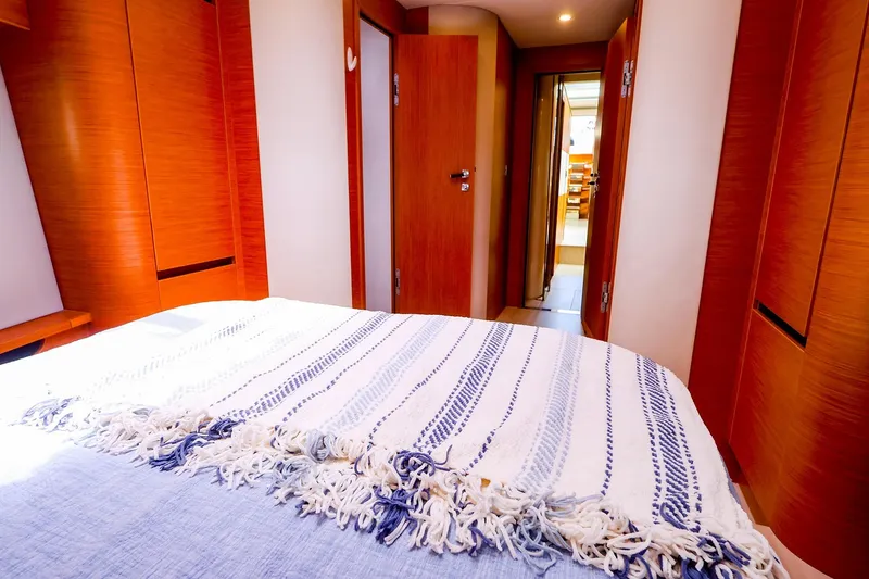Slide: The Image of Interior of 2018 Hanse 675 yacht cabin with cozy bed and wooden finishes. - 73