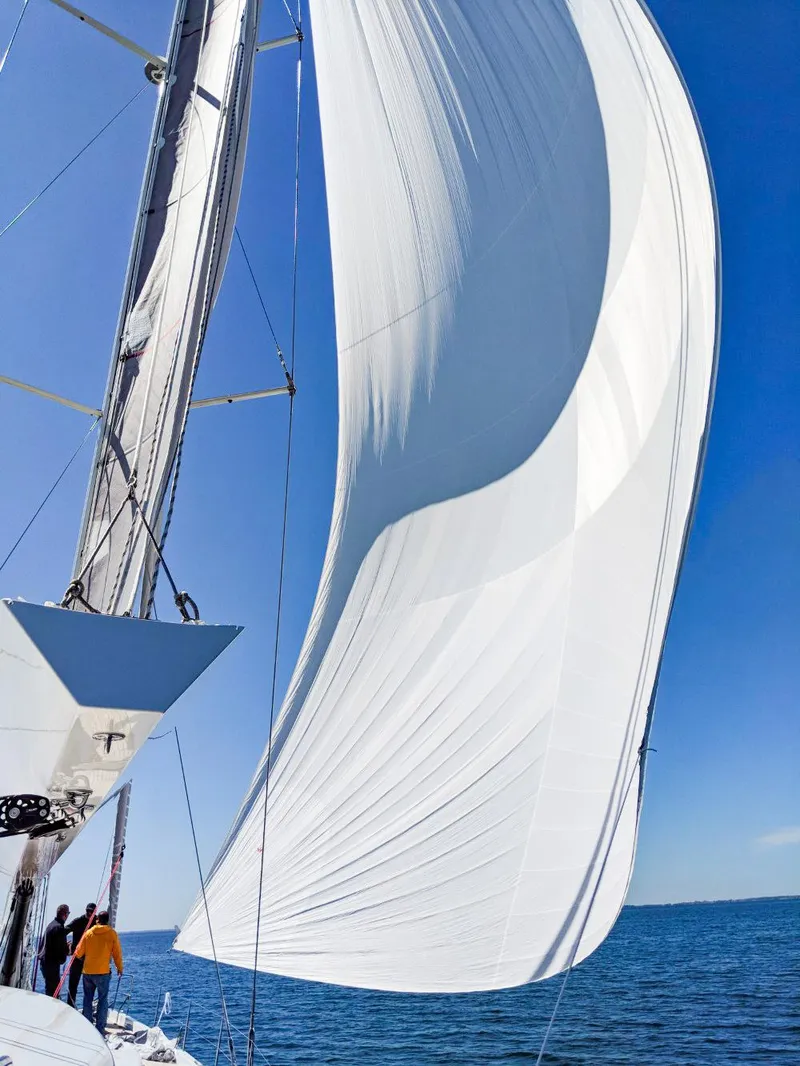 Slide: The Image of Sailing yacht Hanse 675, 2018 model, with billowing white sails on open sea. - 8