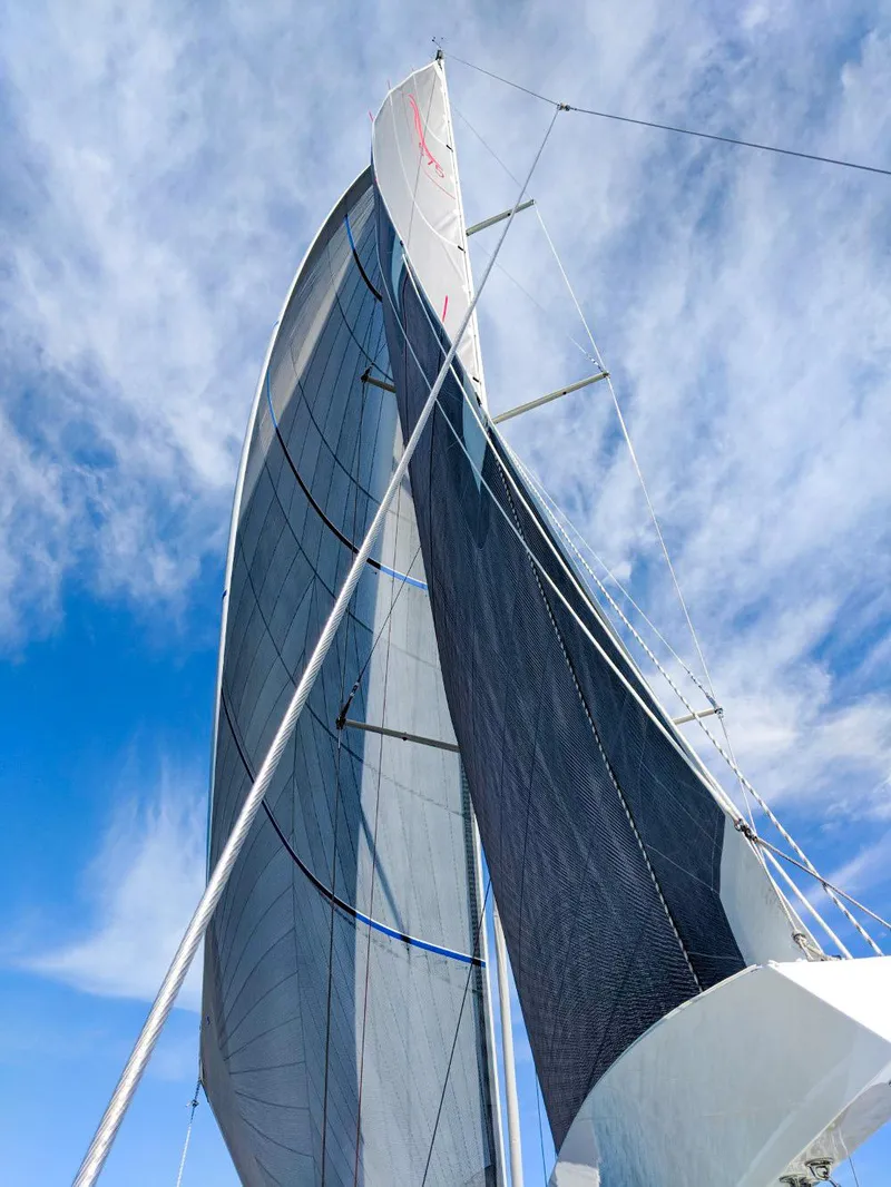 Slide: The Image of Sailing yacht Hanse 675, 2018 model, with sails against a blue sky. - 9