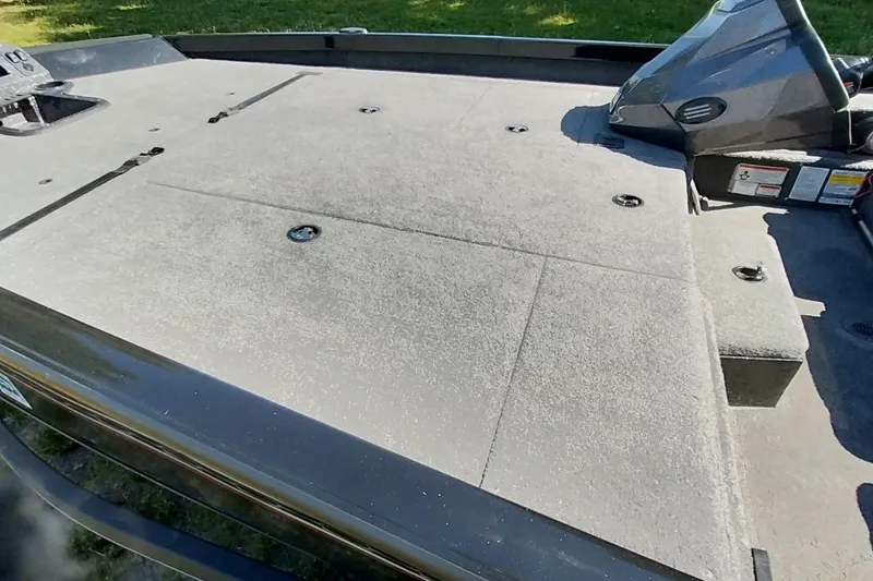 Slide: The Image of 2023 Ranger RT198P boat deck with carpeted surface in sunlight. - 11