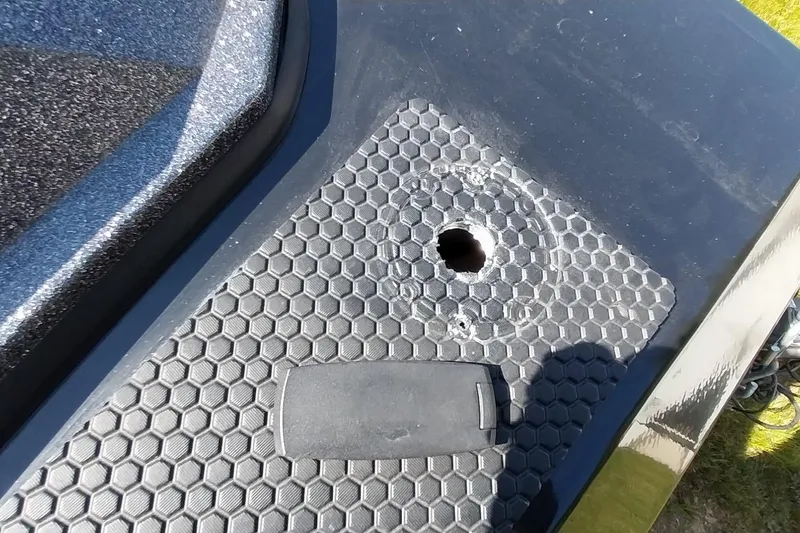 Slide: The Image of 2023 Ranger RT198P boat deck with hexagonal pattern and drilled hole. - 18