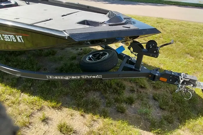 Slide: The Image of 2023 Ranger RT198P boat on trailer, parked on grass. - 20