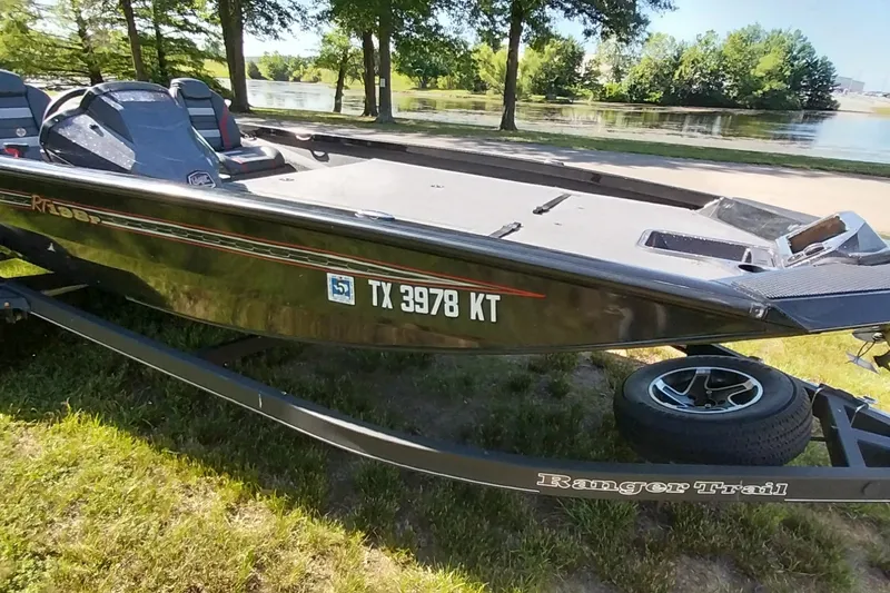 Slide: The Image of 2023 Ranger RT198P boat on trailer by a lake, registration TX 3978 KT. - 25