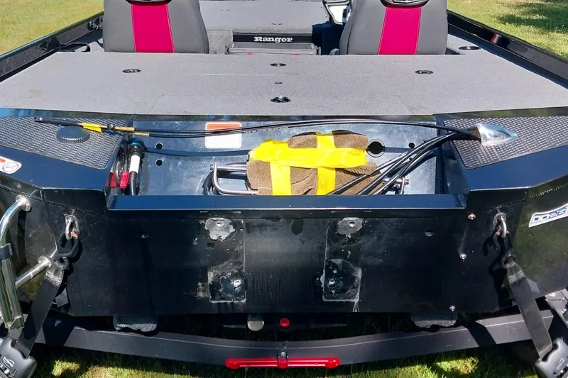 Slide: The Image of 2023 Ranger RT198P boat interior with open storage compartment and seating. - 3