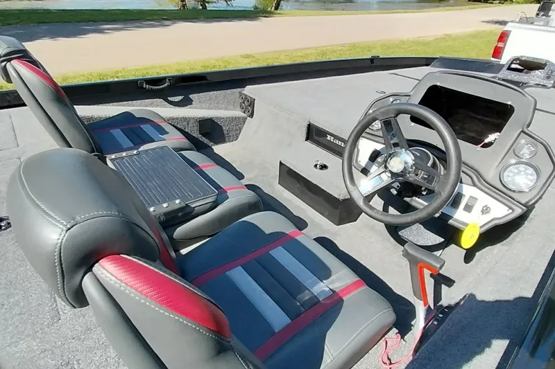 Slide: The Image of 2023 Ranger RT198P boat interior with steering wheel and seating. - 5