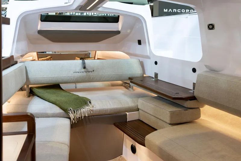 Slide: The Image of Luxurious interior of 2026 Axopar 38 Cross Cabin with modern seating and wooden accents. - 19
