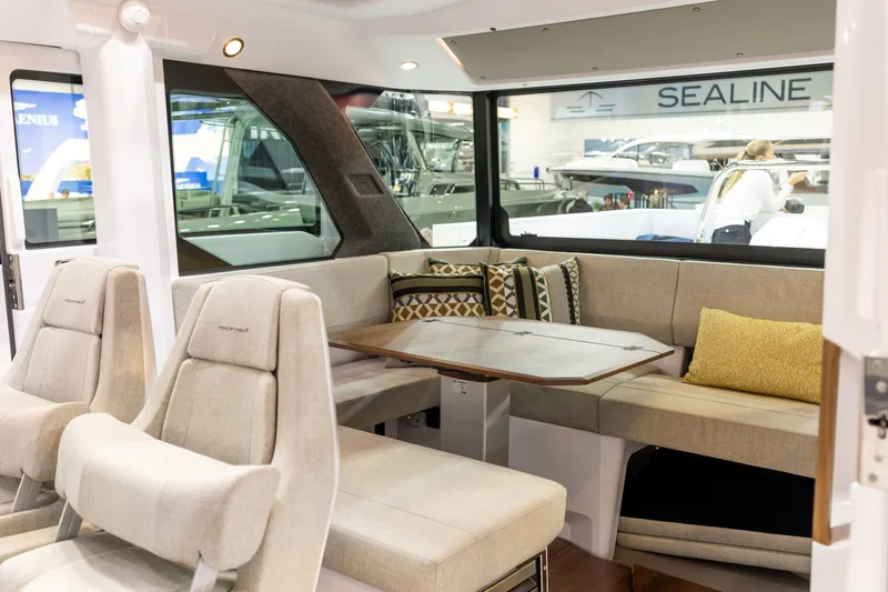 Slide: The Image of Interior of 2026 Axopar 38 Cross Cabin with modern seating and table. - 9
