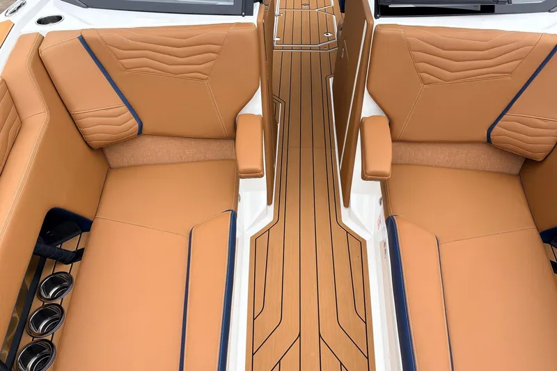 Slide: The Image of Luxurious interior of 2026 Nautique Super Air Nautique G25 with tan leather seating. - 23