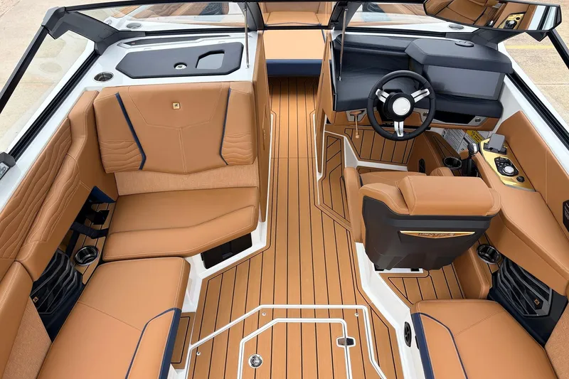 Slide: The Image of Luxurious interior of 2026 Nautique Super Air Nautique G25 with tan leather seating and sleek design. - 27