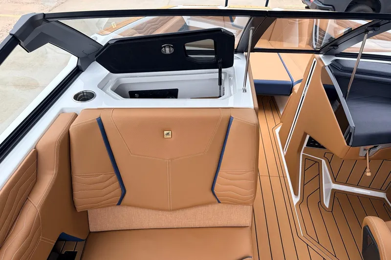 Slide: The Image of 2026 Nautique Super Air Nautique G25 interior with tan seating and sleek design. - 30
