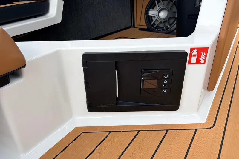 Slide: The Image of 2026 Nautique Super Air Nautique G25 interior with control panel and speaker detail. - 39