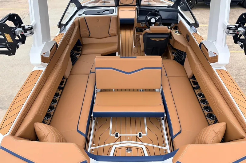 Slide: The Image of Luxurious interior of 2026 Nautique Super Air Nautique G25 boat with tan seating and modern design. - 46