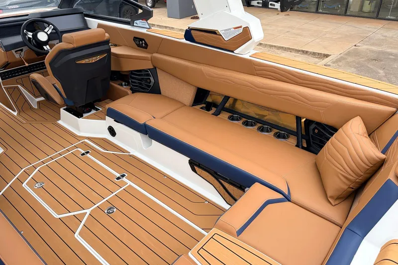 Slide: The Image of 2026 Nautique Super Air Nautique G25 interior with tan leather seating and sleek design. - 51