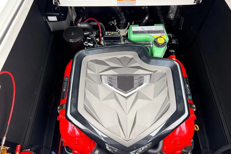 Slide: The Image of Engine compartment of 2026 Nautique Super Air Nautique G25 boat, featuring a powerful engine. - 64