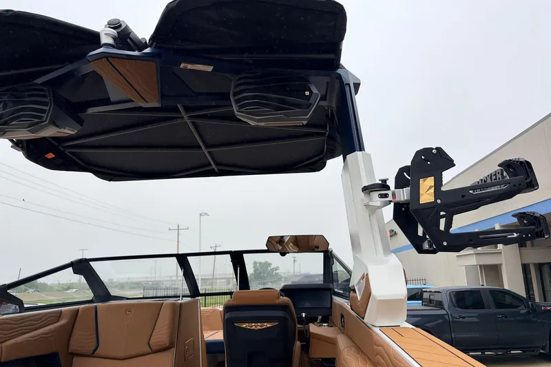 Slide: The Image of 2026 Nautique Super Air Nautique G25 interior with advanced wakeboard tower and premium seating. - 67