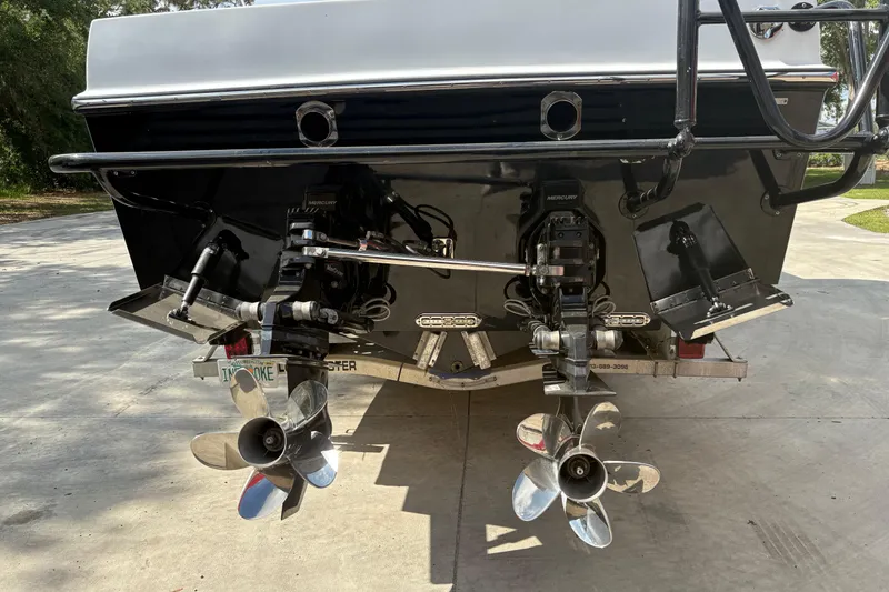 Slide: The Image of Rear view of a 2018 Catamaran Coaches 38 Lightning boat with dual propellers. - 15
