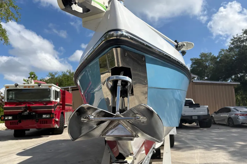 Slide: The Image of 2018 Catamaran Coaches 38 Lightning boat with anchor, parked near vehicles. - 18