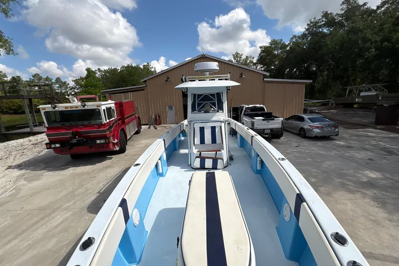 Slide: The Image of 2018 Catamaran Coaches 38 Lightning parked in front of a garage. - 19