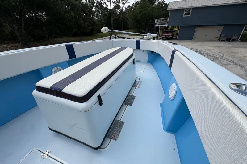 Slide: The Image of 2018 Catamaran Coaches 38 Lightning boat interior with cushioned seating and storage. - 24