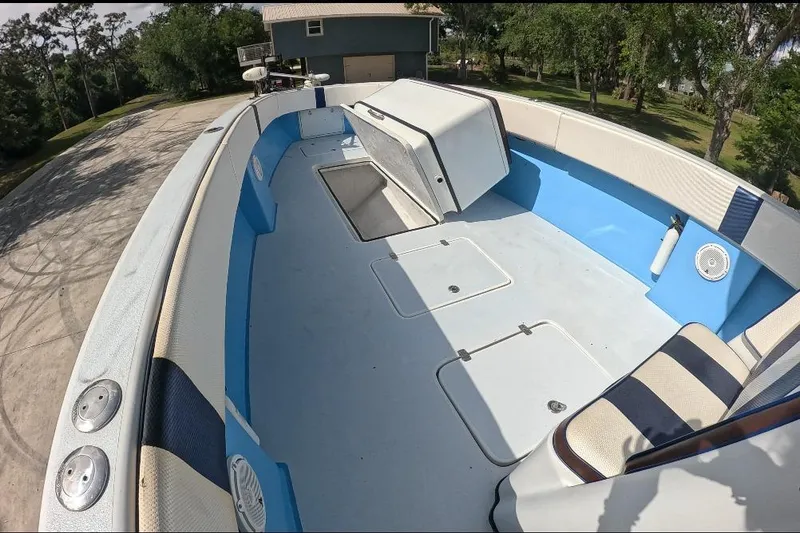 Slide: The Image of 2018 Catamaran Coaches 38 Lightning boat interior with blue and white seating. - 31