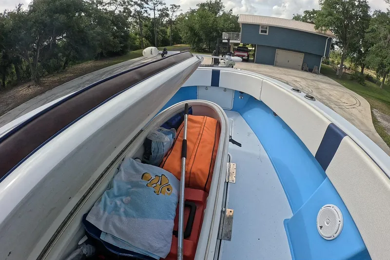 Slide: The Image of 2018 Catamaran Coaches 38 Lightning boat interior with storage compartment open. - 32